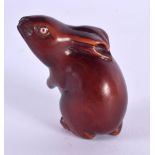 A JAPANESE CARVED BOXWOOD RABBIT NETSUKE. 4 cm x 2 cm.