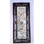 A large Chinese framed porcelain panel decorated with a peacock and other birds. 75 x 21 cm
