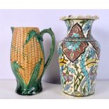 A TURKISH MIDDLE EASTERN IZNIK TYPE VASE and a majolica corn jug. Largest 26.5 cm high. (2)