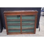 A wooden glass fronted hanging cabinet 100 x 124 x 20 cm.