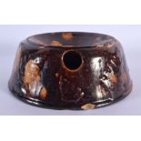 A RARE EARLY 19TH CENTURY TREACLE GLAZED POTTERY SPITTOON. 16 cm wide.