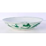 A Chinese porcelain dish decorated with a dragon in relief 22.5 cm.