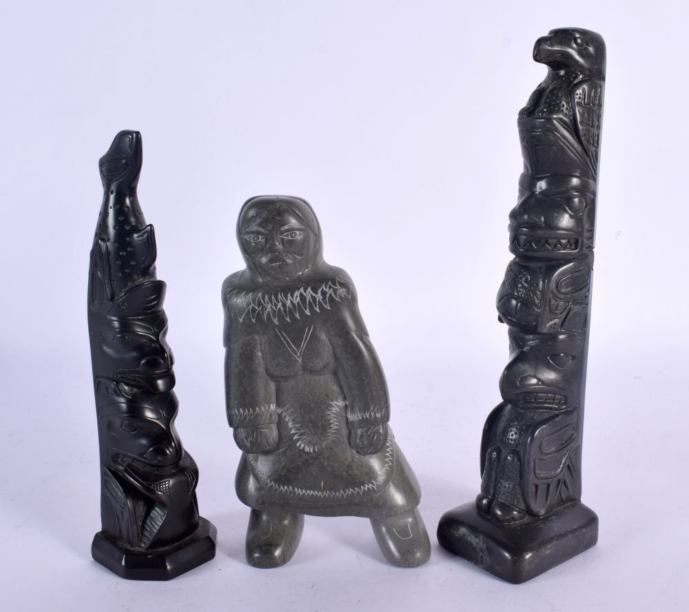 A NORTH AMERICAN CANADIAN CARVED BLACK STONE TOTEM POLE together with another & a Inuit stone figure