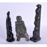 A NORTH AMERICAN CANADIAN CARVED BLACK STONE TOTEM POLE together with another & a Inuit stone figure