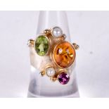 A SILVER AND GOLD MULTI GEM RING. 5.5 grams. L/M.