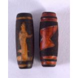 TWO CHINESE TIBETAN AGATE ZHU BEADS. 4 cm long. (2)