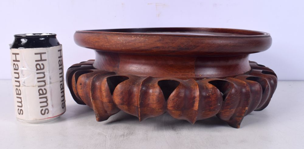 A LARGE CHINESE CARVED HARDWOOD STAND Late Qing/Republic. 30 cm x 12 cm.