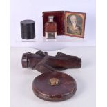 An antique leather cased glass hunting flask, a concertina medicine glass, hip flask, a Chesterman
