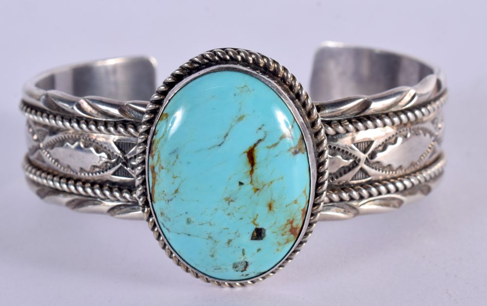 NATIVE AMERICAN SILVER AND TURQUOISE BANGLE. Stamped Sterling, 6.1cm x 4.6cm, weight 71.3g