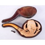 A LARGE ANTIQUE CARVED AMBER AND MEERSCHAUM CLAW PIPE. 18 cm x 7 cm.