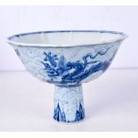 A Chinese porcelain blue and white stem cup decorated with dragons 36 cm.