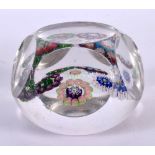 AN UNUSUAL ANTIQUE MULTI FACETTED GLASS PAPERWEIGHT possibly Clichy or Baccarat. 6.75 cm wide.