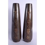 A LARGE PAIR OF 19TH CENTURY JAPANESE MEIJI PERIOD BRONZE VASES unusually decorated with calligraphy