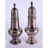 A PAIR OF EARLY 18TH CENTURY SILVER PEPPERETTES. London 1736. 180 grams. Largest 14.5 cm x 5 cm.