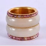 A RARE CHINESE 22CT GOLD AND WHITE JADE RING. 22 grams. 2.25 cm wide.