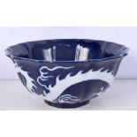 A Chinese porcelain petal shaped sacrificial blue bowl with decorated in relief with dragon 10 x 2