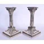 A PAIR OF EDWARDIAN SILVER COLUMN CANDLESTICKS. Sheffield 1906. 1062 grams overall. 17 cm x 9 cm.