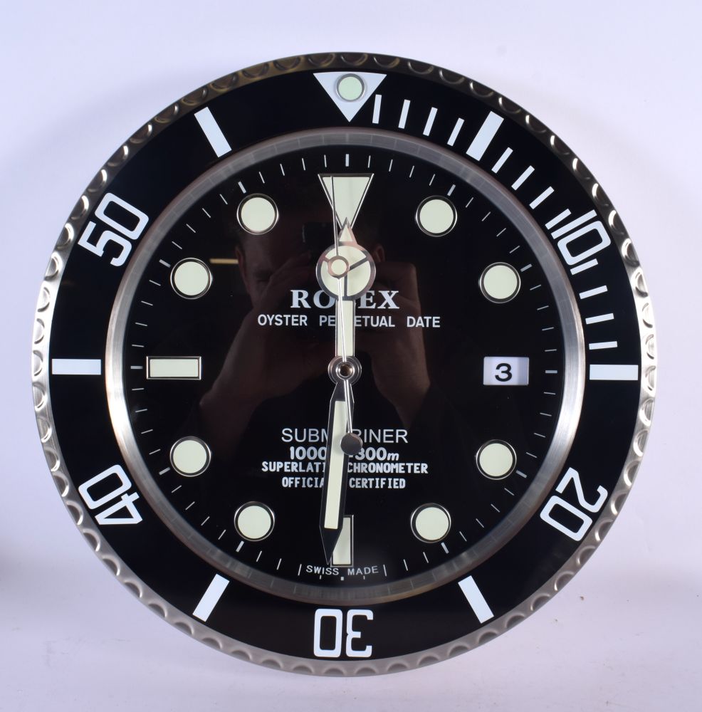 A ROLEX SHOP DISPLAY ADVERTISING WALL CLOCK. 33 cm diameter.