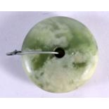 A CHINESE QING DYNASTY CARVED GREEN JADE BI DISC TOGGLE. 4.5 cm wide.