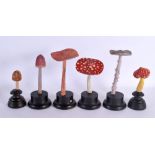 SIX FOLK ART CARVED WOOD MUSHROOM SPECIMENS Largest 26 cm high. (6)