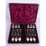 CASED SILVER SPOONS AND TONGS. Sheffield 1896 & 1897. 129 grams. Largest 11 cm x 4.5 cm. (13)