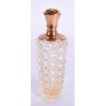 AN 18CT GOLD CRYSTAL GLASS SCENT BOTTLE. 9 cm x 3 cm.