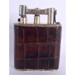 A VINTAGE DUNHILL LEATHER WRAPPED LIGHTER. 11 cm x 8 cm.