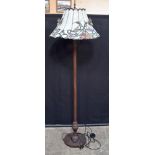 A metal lampstand with a large Tiffany style shade 164 cm.