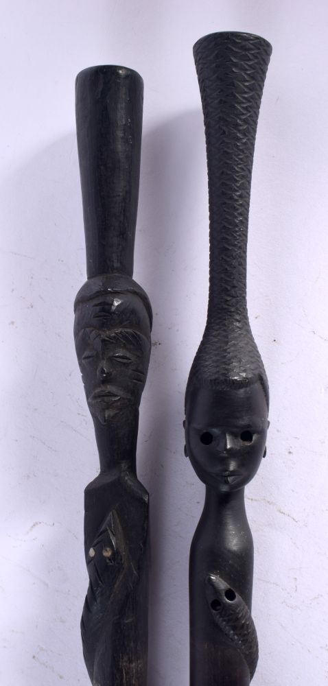 TWO AFRICAN TRIBAL EBONY WALKING STICKS. 85 cm long. (2)