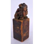 A CHINESE CARVED SOAPSTONE SEAL 20th Century. 12.5 cm high.