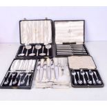 THREE CASED SETS OF SILVER SPOONS together with a cased set of silver handled knives etc. Birmingham