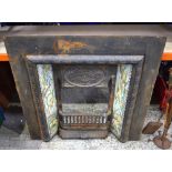 A cast Iron tiled fireplace 97 x 97 cm.