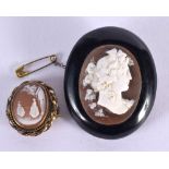 AN UNUSUAL VICTORIAN JET CAMEO BROOCH and another cameo brooch. 24.8 grams. Largest 5 cm x 4 cm. (2)