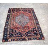 A Persian Heriz rug 184 x 116 cm