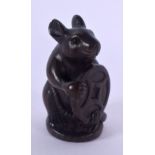 A JAPANESE CARVED BOXWOOD RAT AND COIN NETSUKE. 4.5 cm x 2.5 cm.