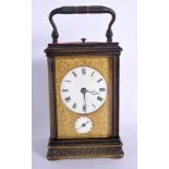 A FINE 19TH CENTURY REPEATING BRASS CARRIAGE CLOCK with alarm, engraved all over with foliage and vi