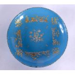 AN 18TH CENTURY FRENCH SEVRES TYPE ENAMELLED DISH overlaid in raised gilt. 16.5 cm diameter.