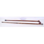 Two wooden walking canes one with a white metal handle 90 cm (2)