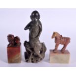 A 19TH CENTURY CHINESE CARVED SOAPSTONE HORSE together with a seal & a figure. Largest 15 cm high. (