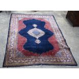 A large Kerman wool rug.312 x 216 cm