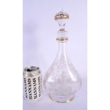 AN EARLY 20TH CENTURY EUROPEAN CRYSTAL GLASS DECANTER AND STOPPER engraved with vines and motifs. 33