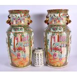 A LARGE PAIR OF 19TH CENTURY CHINESE CANTON FAMILLE ROSE VASES Qing, painted with figures and birds.