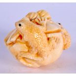 A JAPANESE CARVED BONE GROUP OF TOADS. 5 cm x 3 cm.
