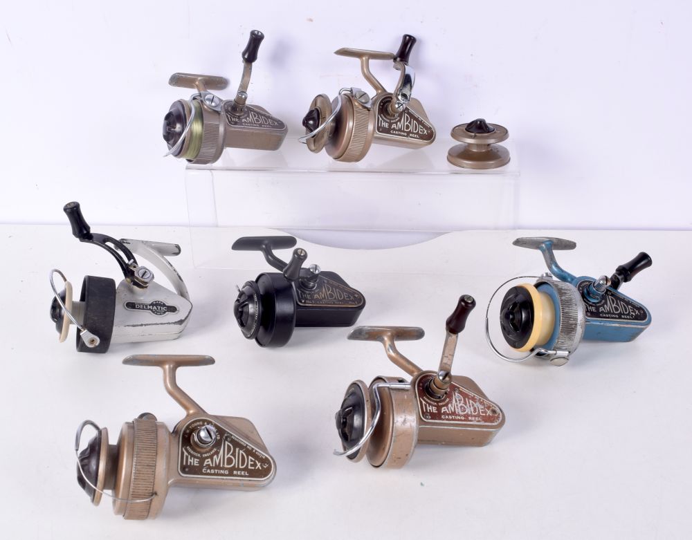 A collection of vintage J W Young Ambidex fixed spool fishing reels together with an Allcocks reel (