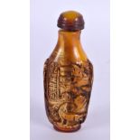 A CHINESE CARVED AMBER TYPE SNUFF BOTTLE 20th Century. 7 cm high.