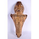 A RARE 19TH CENTURY CONTINENTAL TRIBAL CARVED AND ENGRAVED HORSE SKULL decorated with animals and mo