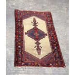 A Persian rug 194 x 100 cm