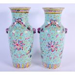 A PAIR OF EARLY 20TH CENTURY CHINESE FAMILLE ROSE VASES Guangxu mark and period, painted with foliag