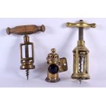 A RARE MINIATURE ANTIQUE BRASS LANTERN together with two corkscrews. 18 cm long. (3)