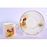 Royal Worcester coffee can and saucer painted with game birds by P. Platts, signed, date code 1955.